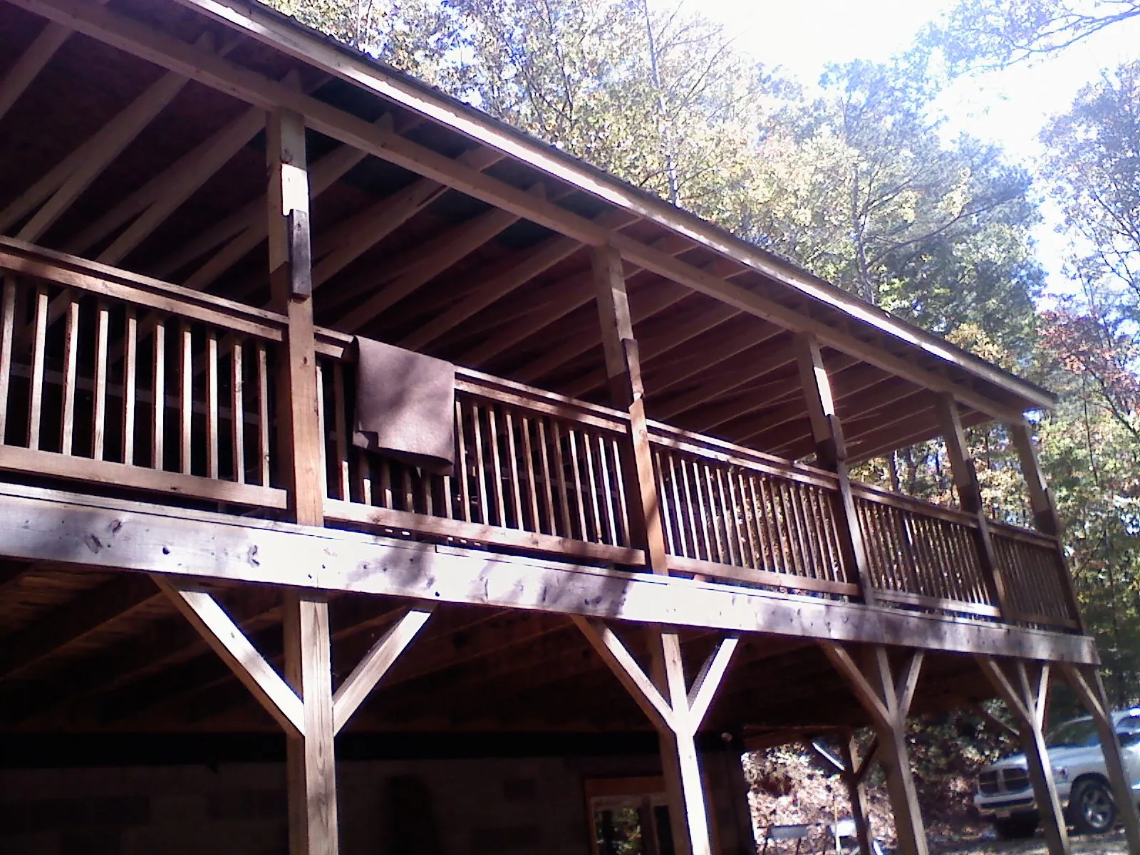 Timber framing under a new elevated porch and deck — Roof Leak Repair in East Providence by Roofing Brothers